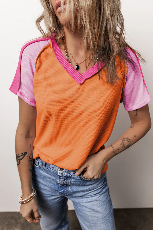 Bold and Bright: Trendy Exposed Seam Color Block Knitted V Neck T-shirt – Only $28.95!